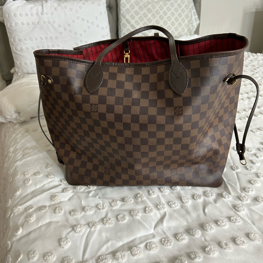 Over the shoulder LV bag. Great condition. Some wear and tear on bottom of bag.